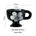 Handmade irregular-shaped ceramic mug in a solid colour glaze, shown on a plain background.