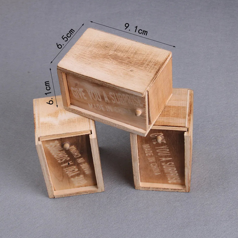 Wooden prank scare box with lifelike jumping animal for April Fools' Day tricks