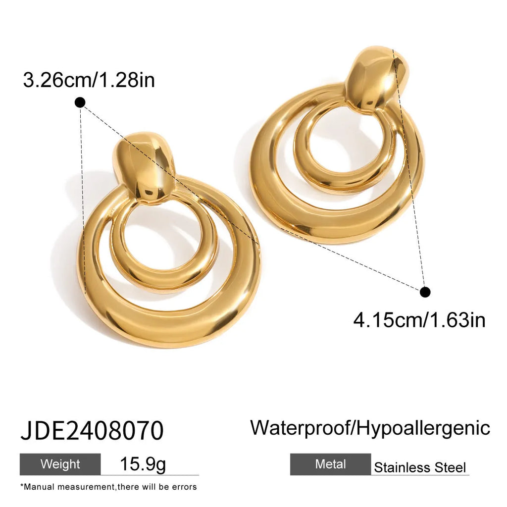 A pair of round, geometric double-layer hollow stud earrings with an 18K gold plated finish.