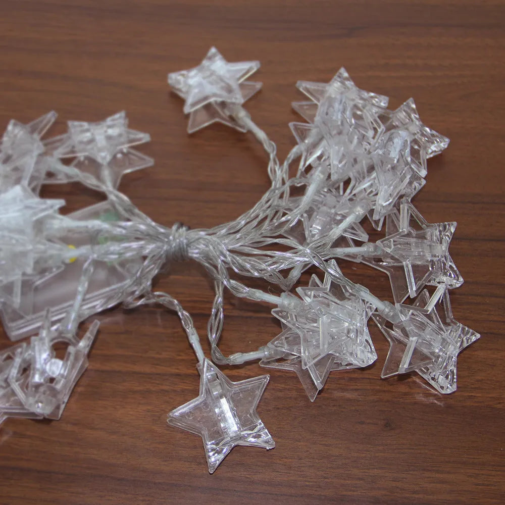 Star clip LED decorative lights on a shelf with warm 3000K glow, 1.5 or 3 metre option