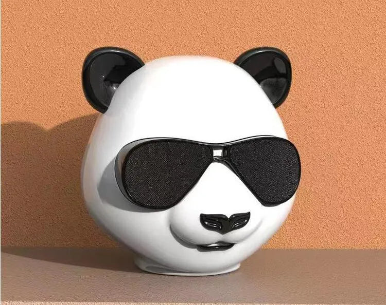 Compact classic style portable mini Bluetooth speaker on a surface.