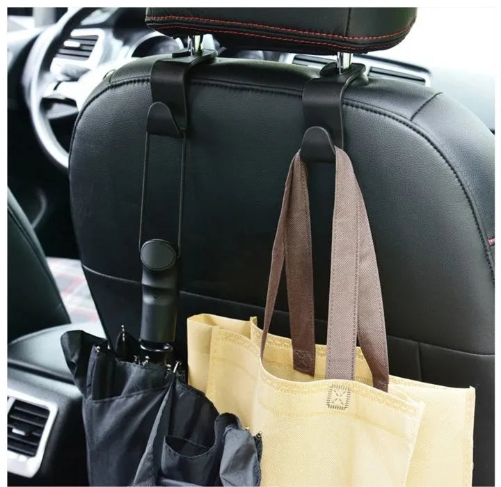 Set of two black OPP car headrest hangers clipped on seat back