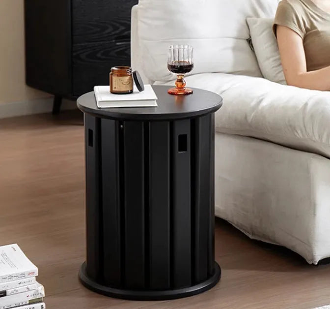 A single modern stackable iron dining stool with a round seat in a cream colour, showing its tubular steel frame.