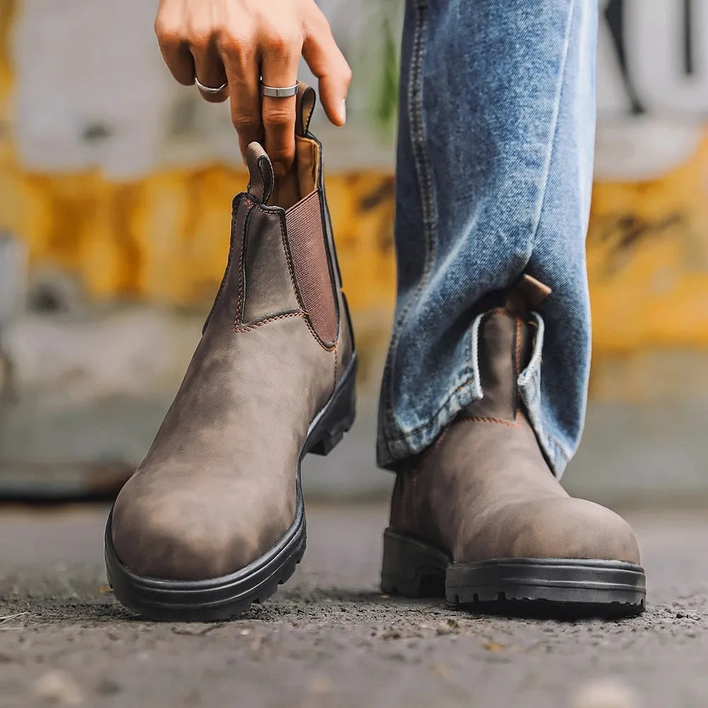 A pair of vintage-style unisex black Chelsea boots with a frosted artificial PU upper and a beef tendon sole.