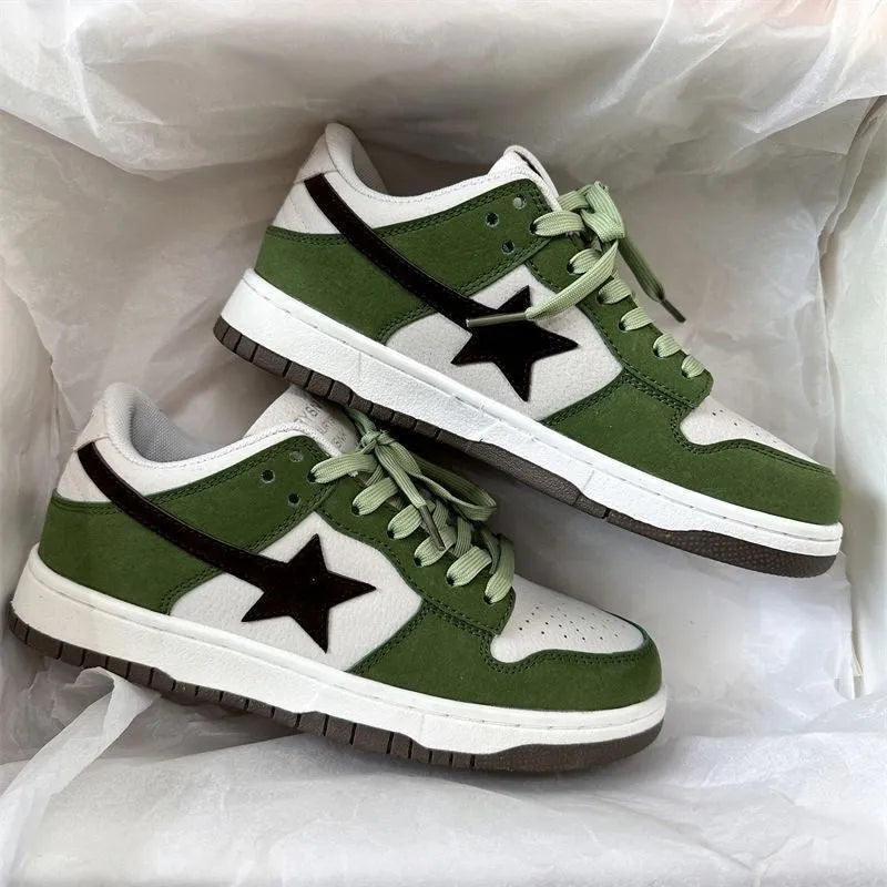 Retro style women's board shoes in green with lace-up closure and flat rubber sole