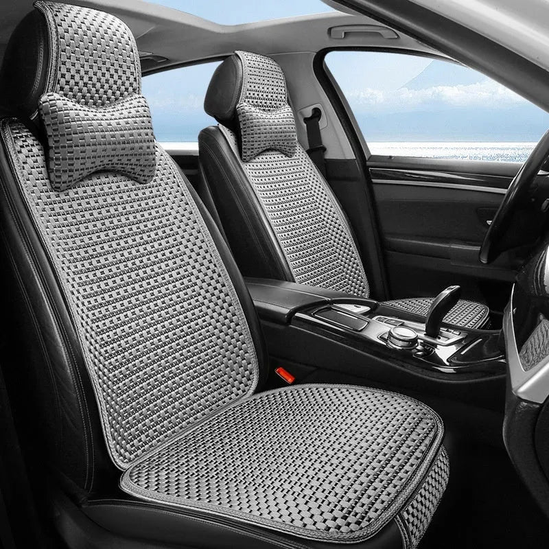 Ice silk car seat cushion in warm cream colour with flat minimalist design sitting on a car seat.