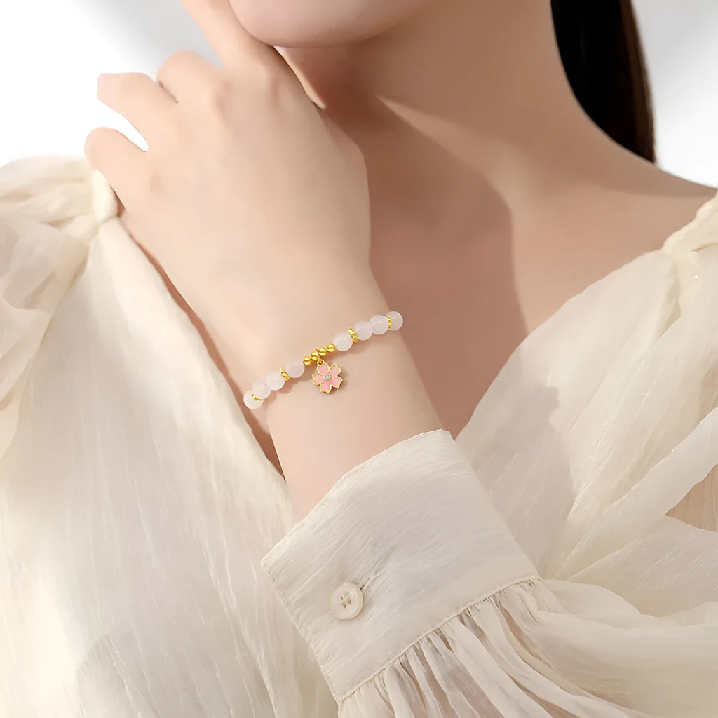 Pink women's bracelet with 925 silver cherry blossom pendant, Hetian jade beads, and gradient epoxy details.