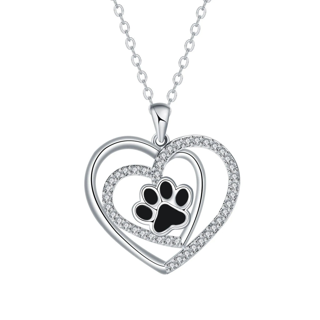 Women's copper necklace with dog paw print and heart detail pendant on cross chain.