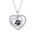 Women's copper necklace with dog paw print and heart detail pendant on cross chain.