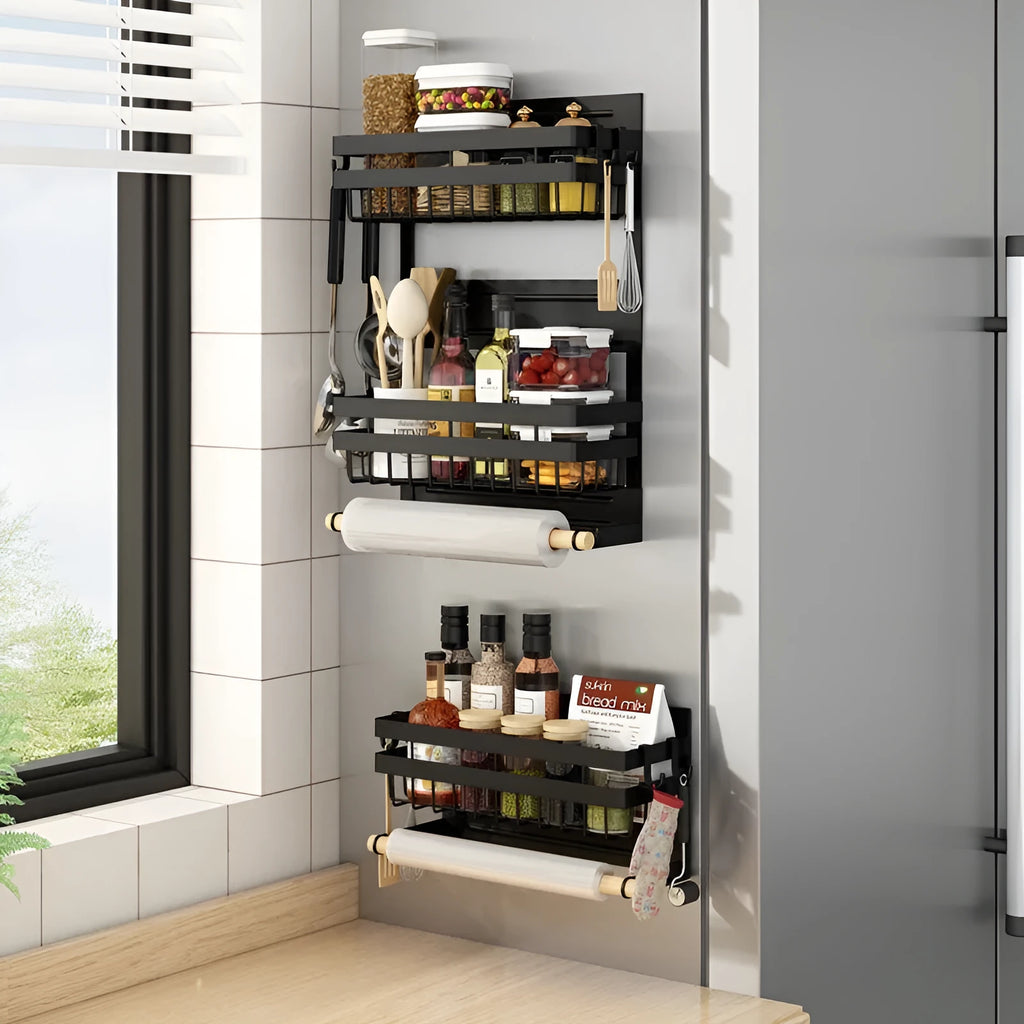 Black magnetic metal refrigerator side storage rack holding a tissue roll and a seasoning bottle