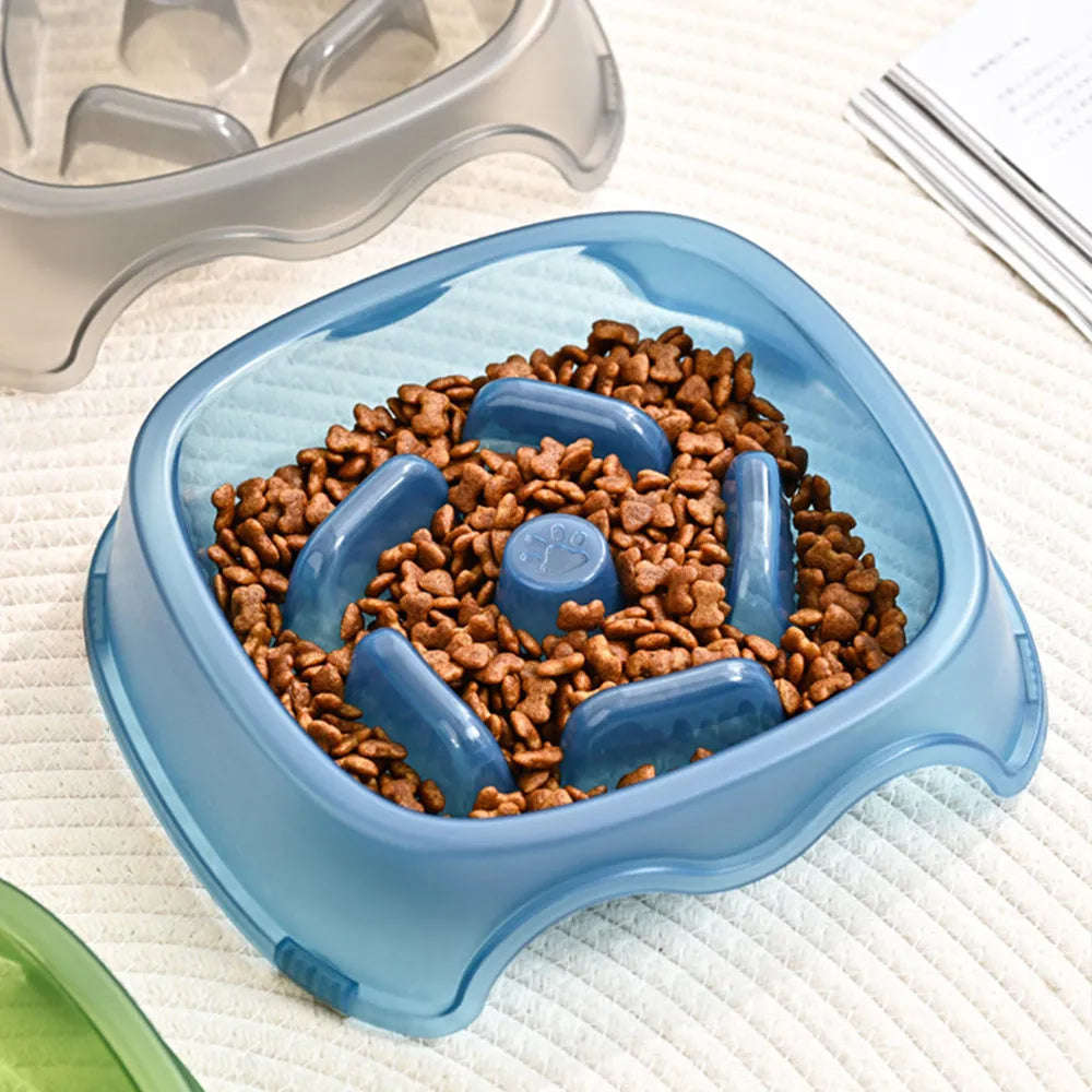 Blue plastic slow feeder dog bowl with internal ridges to prevent choking.