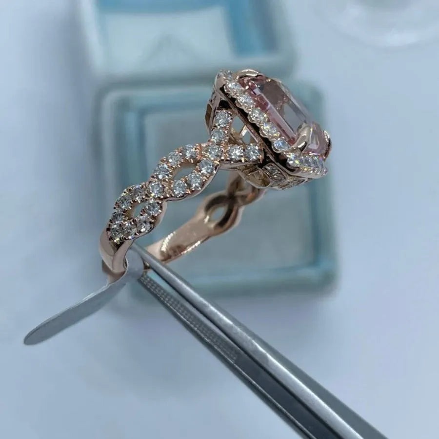 Rose gold coloured geometric alloy ring showing electroplated finish and angular design details