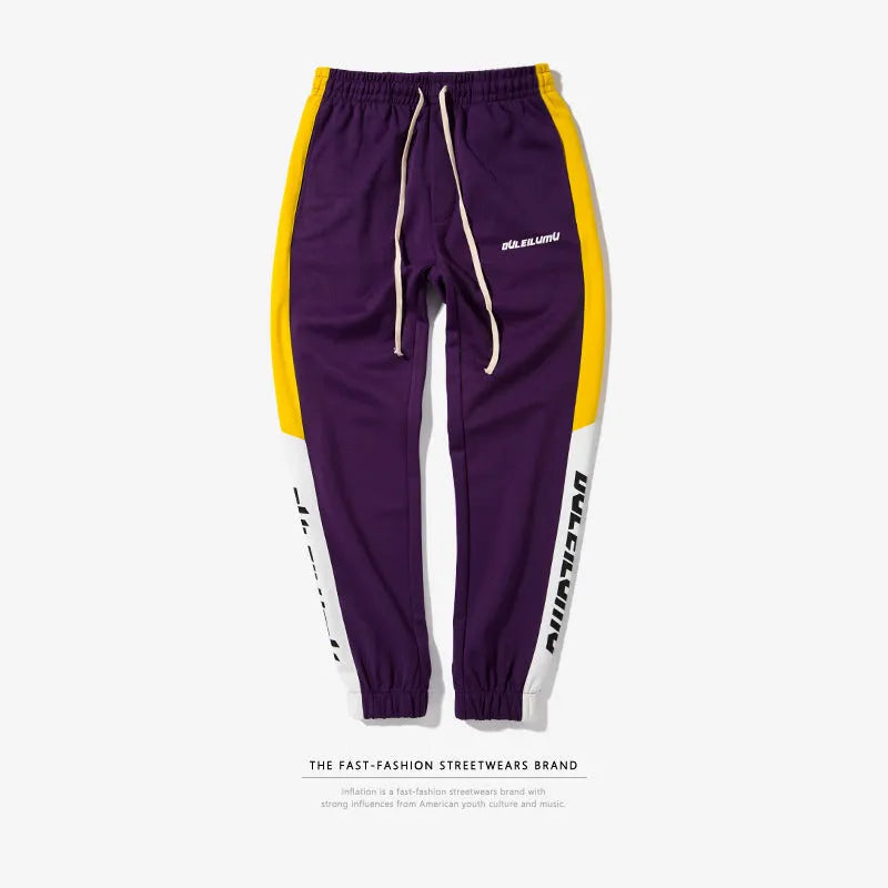Spring men's casual slim fit sweatpants in black and white printed polyester with zippered pockets and drawstring waist