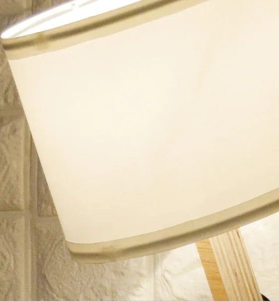 Creative wooden humanoid table lamp with white fabric shade on desk, 22x44x16 cm, button switch