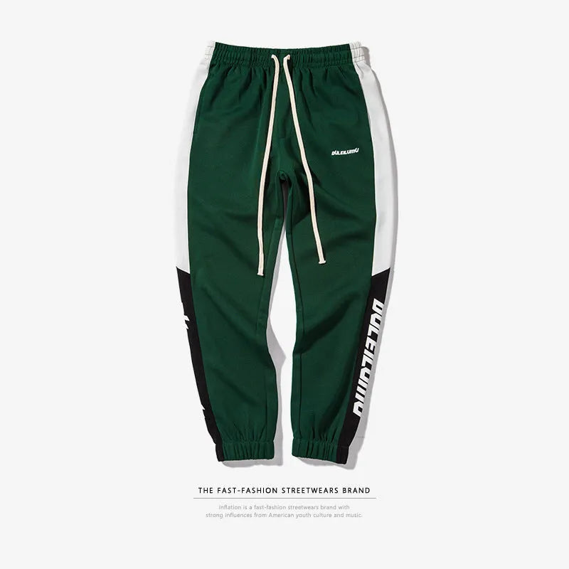 Spring men's casual slim fit sweatpants in black and white printed polyester with zippered pockets and drawstring waist