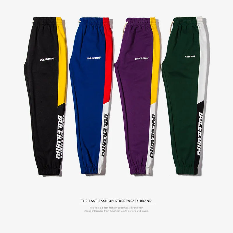 Spring men's casual slim fit sweatpants in black and white printed polyester with zippered pockets and drawstring waist
