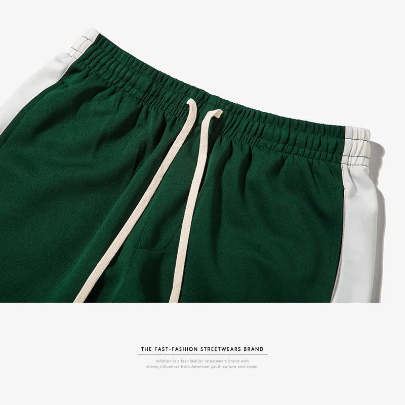 Spring men's casual slim fit sweatpants in black and white printed polyester with zippered pockets and drawstring waist