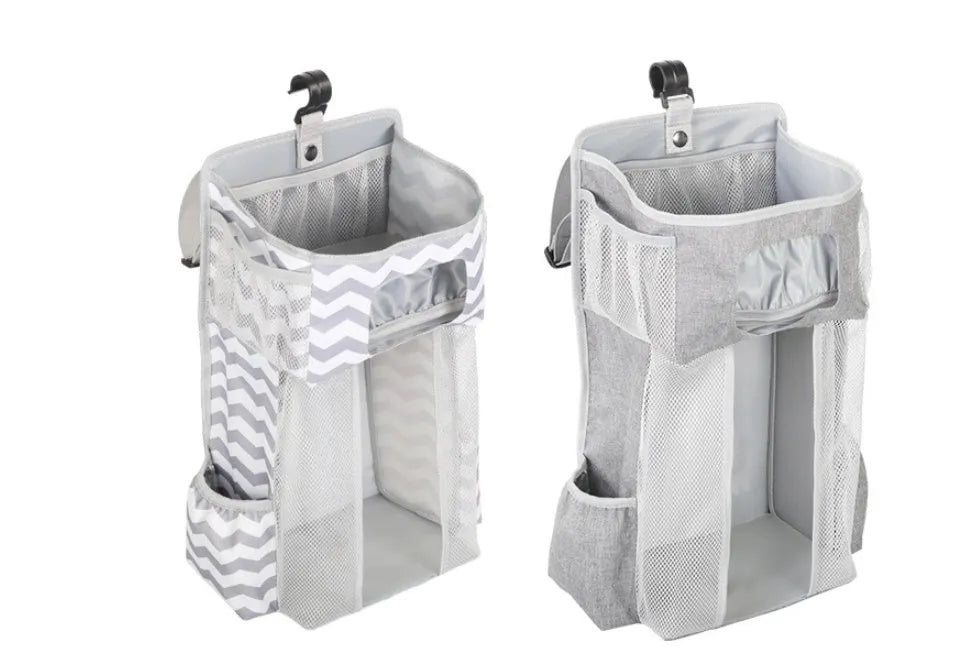 Grey attachable storage bag with diamond mesh panel and PP support plate, 44.6x23x16cm, hung on a white baby cot