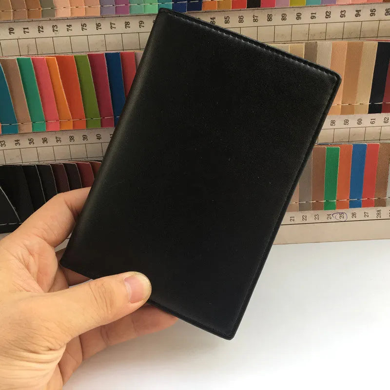 Black RFID antimagnetic passport holder made of genuine leather, open showing card slots and passport slot, 15cm long.