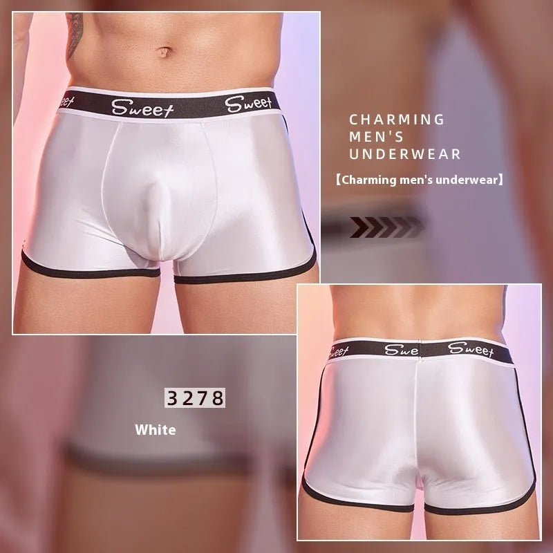 Men's silky shiny boxer shorts in black, white and sapphire blue colours on hanger