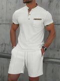Men's gray waffle texture short sleeve polo suit with matching shorts on a hanger