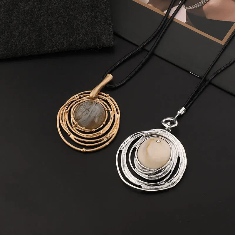 Vintage women's sweater chain necklace with large round geometric pendant in gold finish