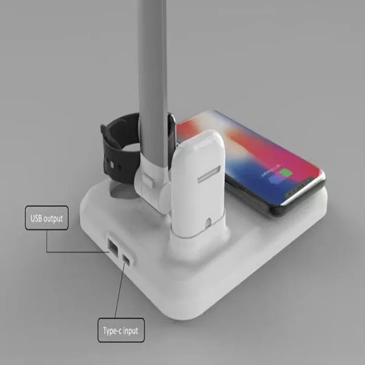 Black and white multi-function LED desk lamp with integrated wireless charging pad for mobile phones.