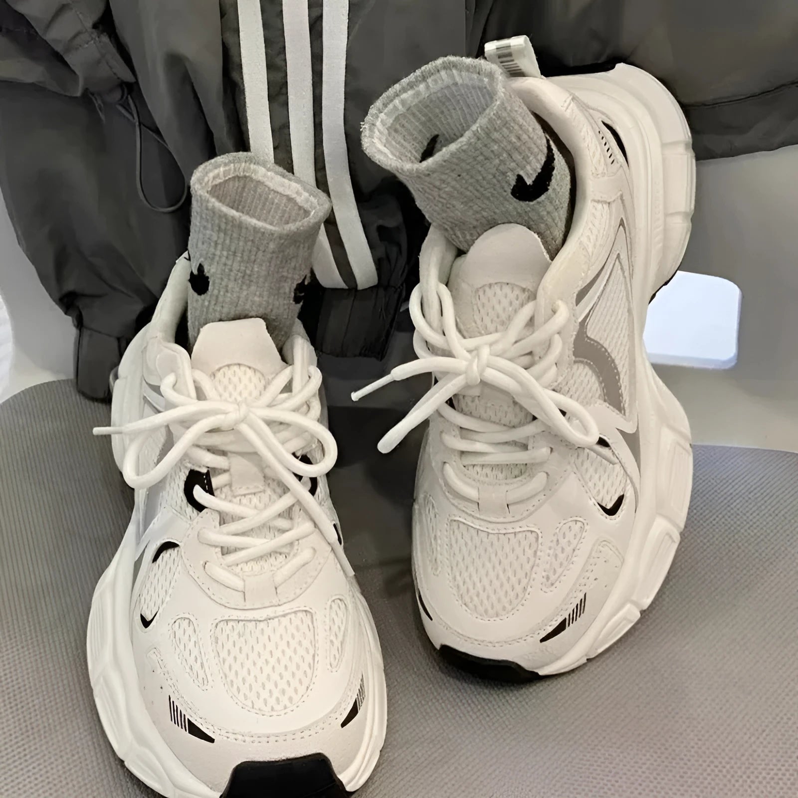 Beige mesh platform casual sports shoes with a wedge heel and front lace-up design on a rubber sole.
