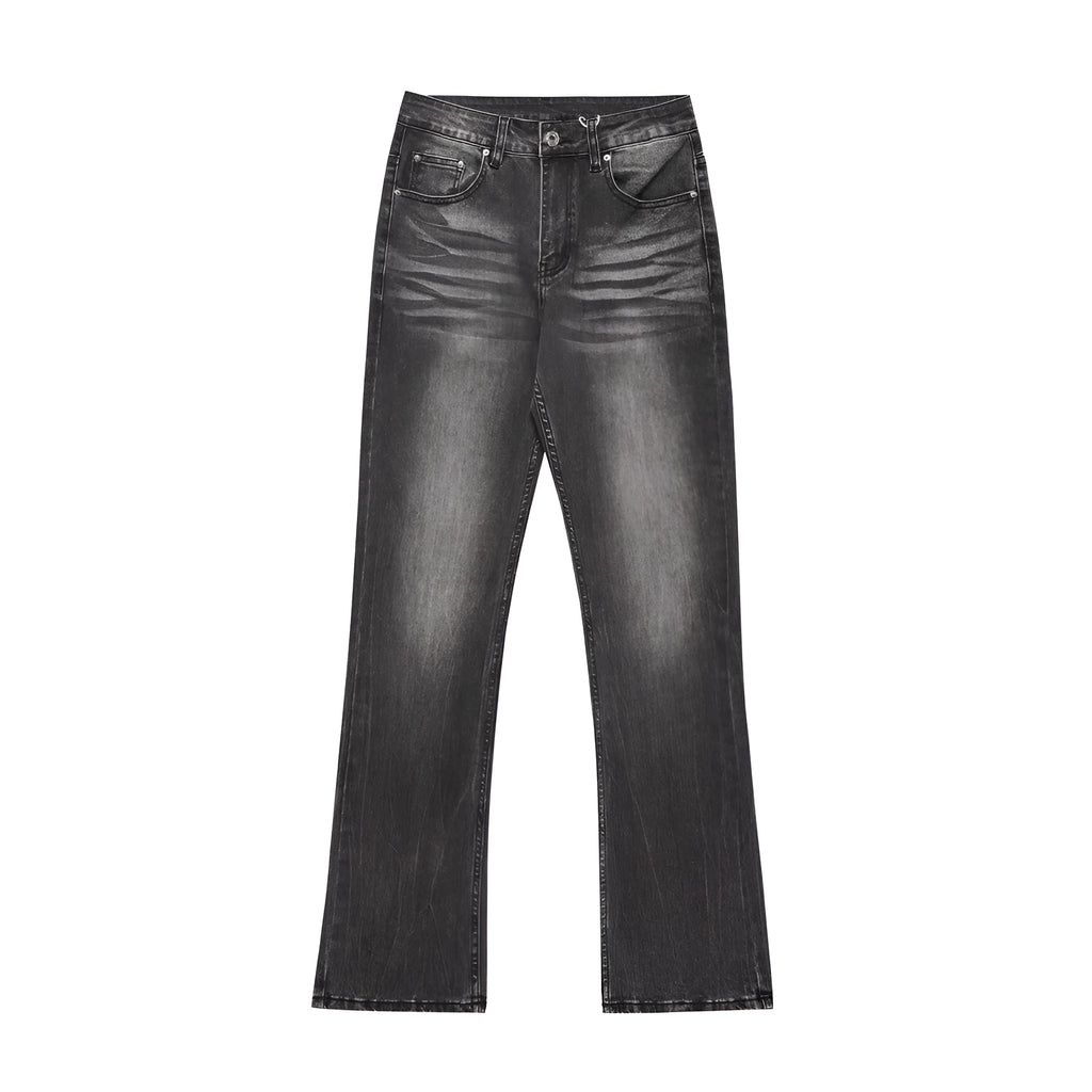 Men's black washed denim jeans on a flat surface showing full leg and pocket details