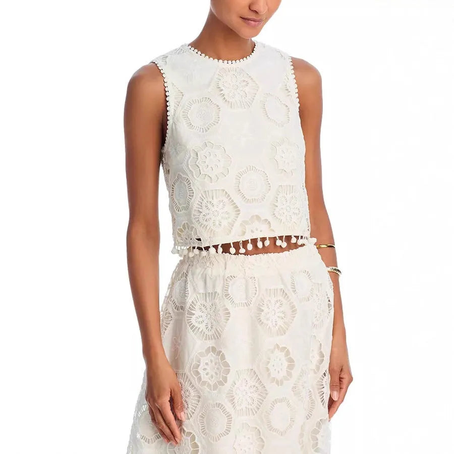 Literary Trends white women's suit with embroidered detail on sleeveless top and long skirt