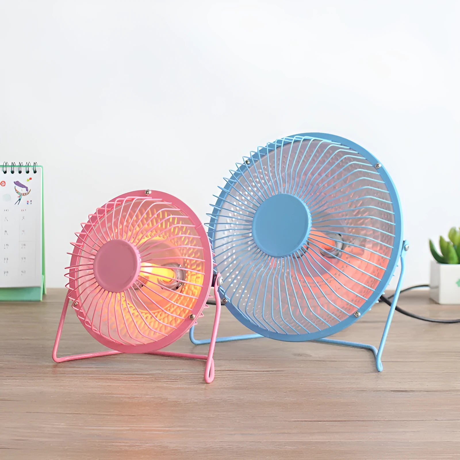Bakingl Little Sun 4 inch black electric fan heater on a desk with quiet energy-saving operation
