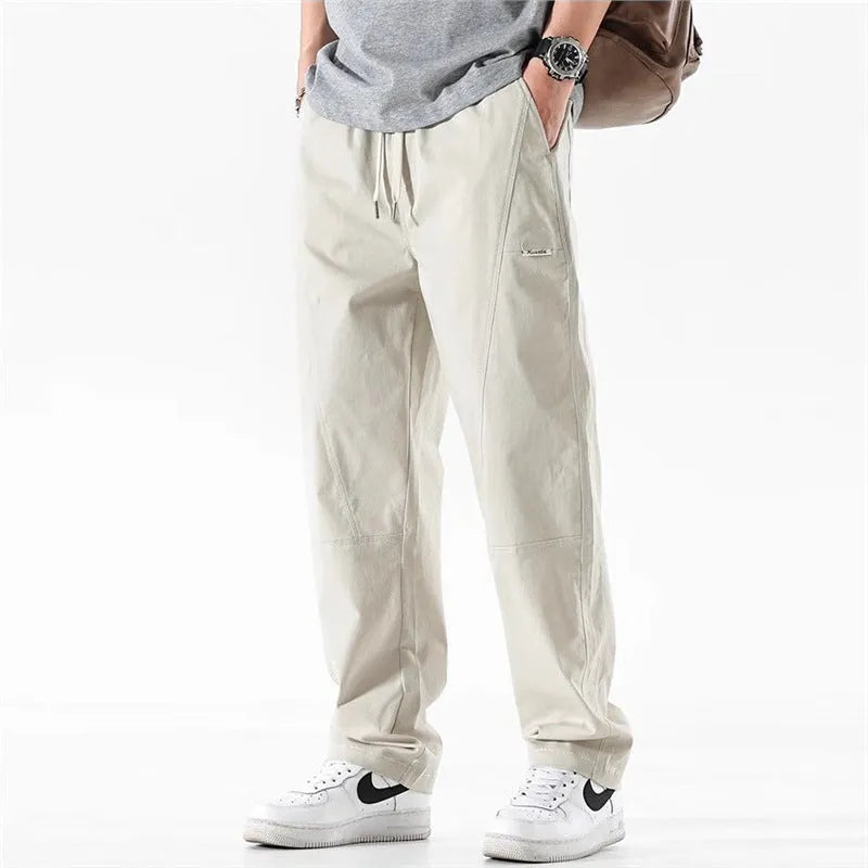 Antibacterial cotton wide-leg trousers in milky white showing the all-matching pants-mouth ankle design.
