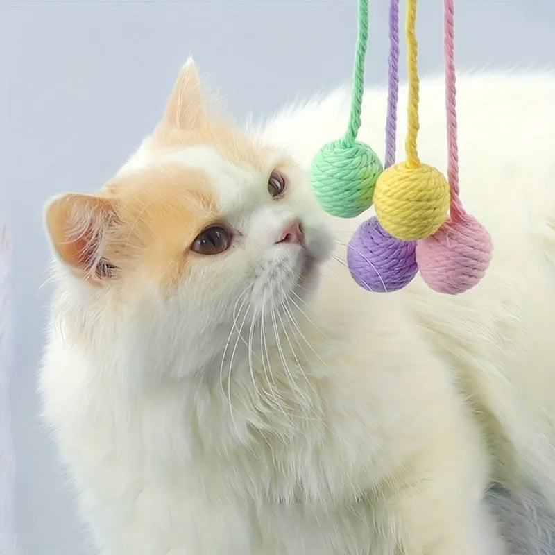 Cat toy ball with rope attached in green, pink, purple or yellow colour with internal bell
