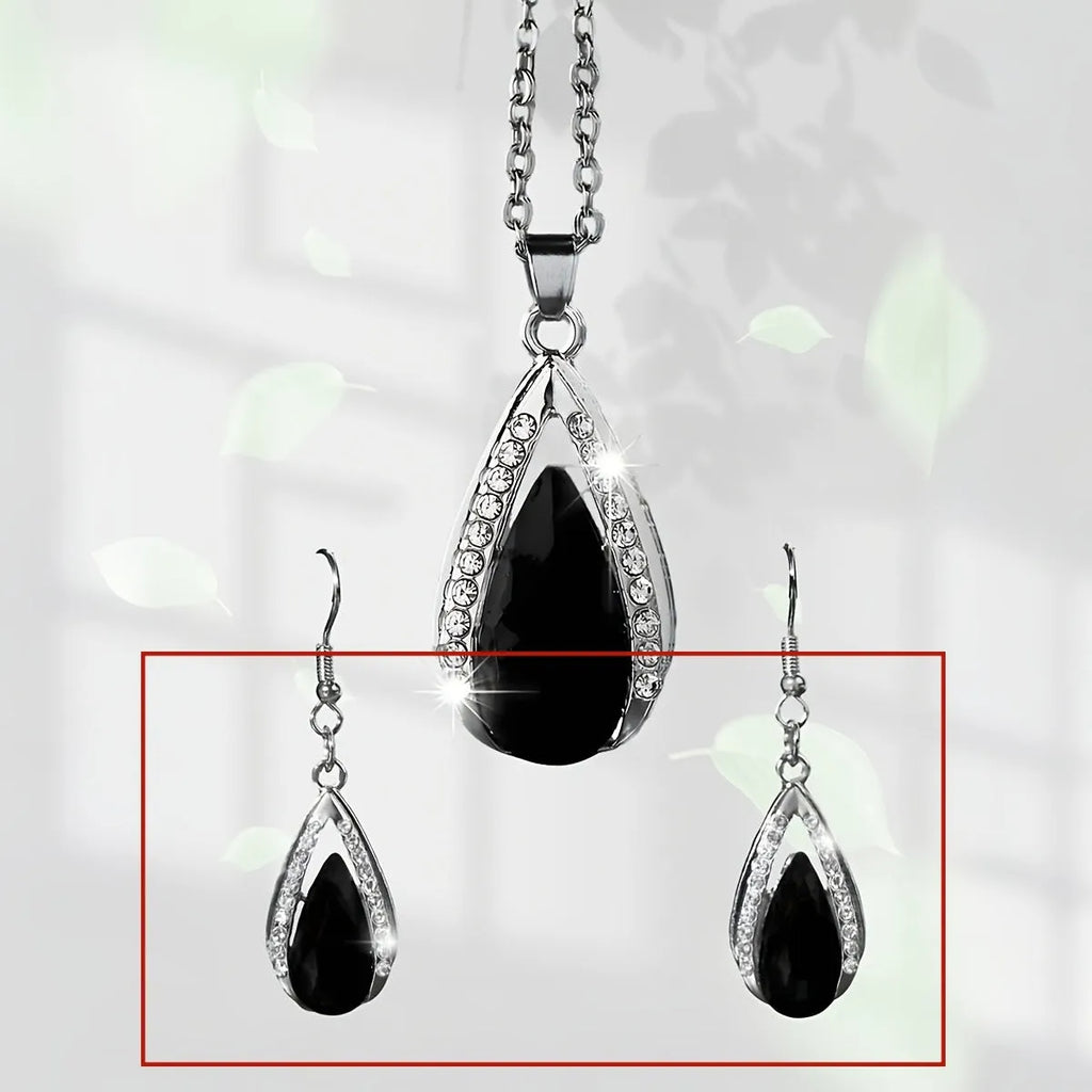 Black and red teardrop-shaped glass pendant necklace and matching earrings set made from alloy.