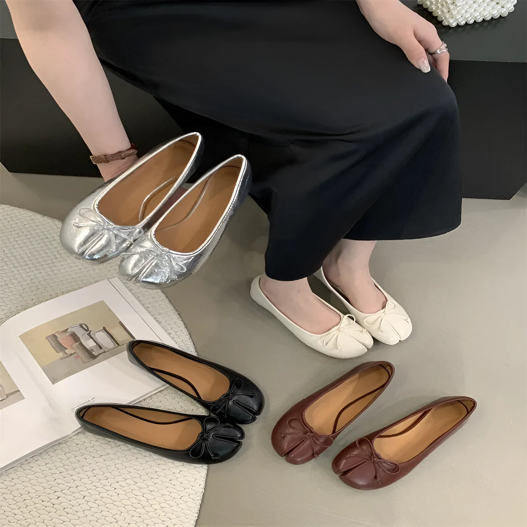 Women's flat split-toe pumps in beige with round toe and rubber sole.