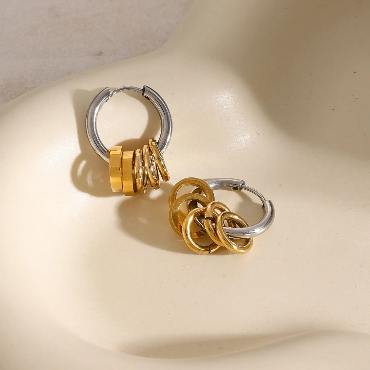 Pair of modern stainless steel earrings with electroplated colour finish in unisex ins style.