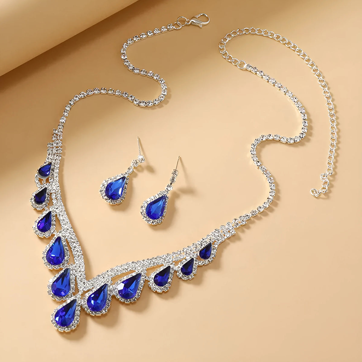 Sapphire blue alloy clavicle chain necklace and earrings set in Royal Blue White K finish on display