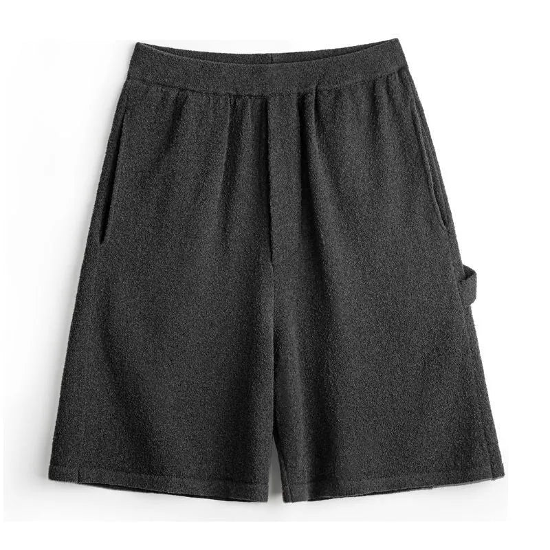 Cement grey men's straight-leg sports shorts with elastic waistband showing fifth-pants length measurement
