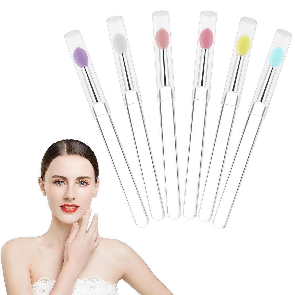 Set of reusable silicone lip brushes with protective caps in various colours on a white background.