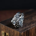 Silver open ring with a detailed Jibeast animal zodiac pattern and diamond design on a white background.