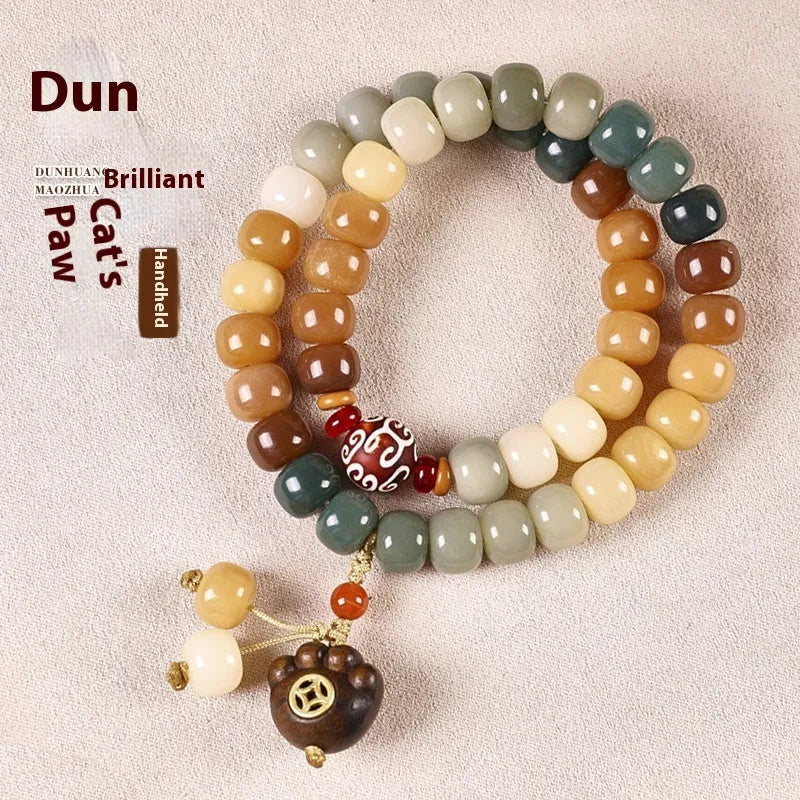 Dunhuang style double ring bracelet made from brown bodhi seeds, showing detailed bead texture.