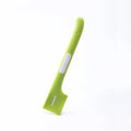 Long handled green pet food spoon for scraping canned wet food for cats and dogs.