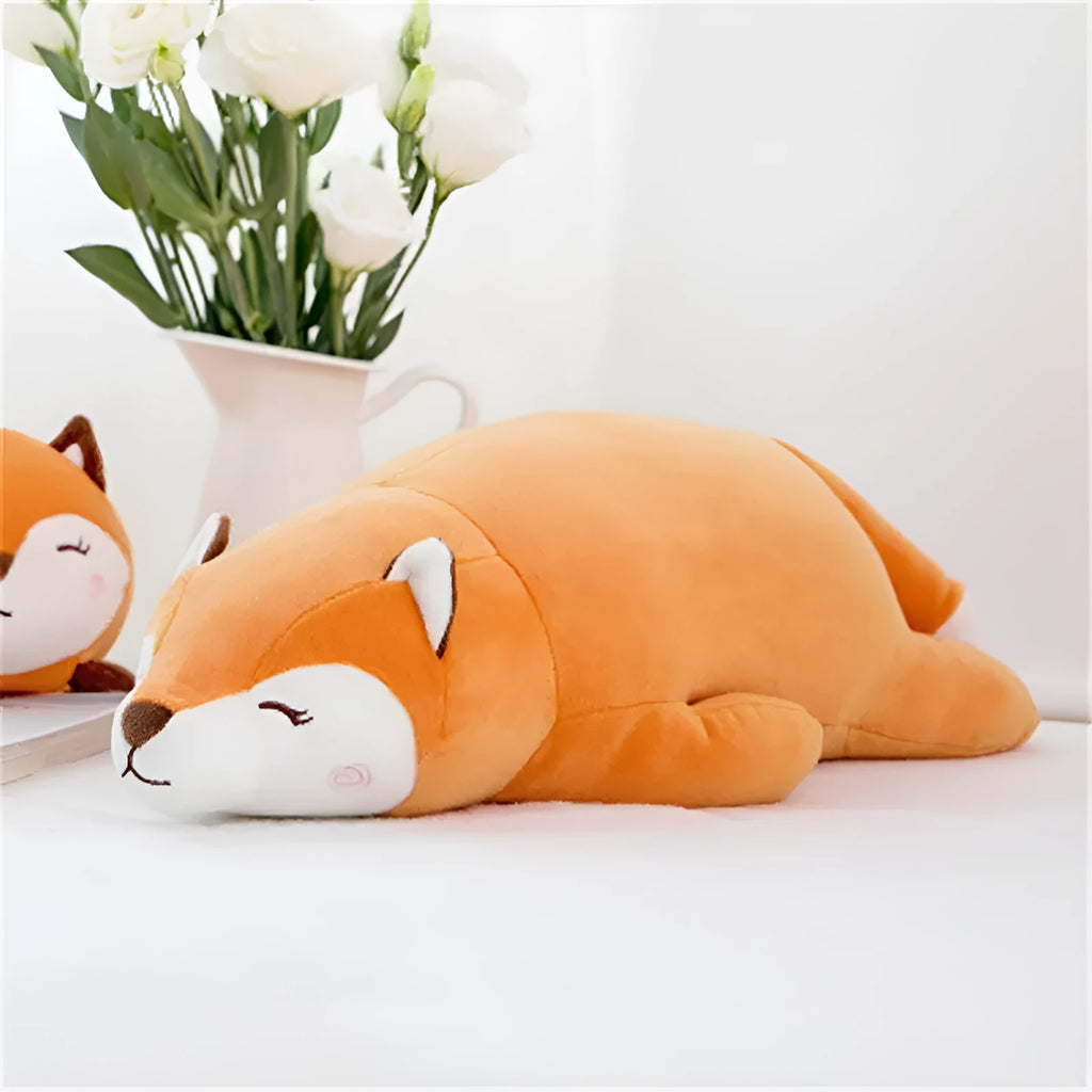 Cute fluffy fat orange fox plush toy on a white background, showing its chubby cartoon shape and soft fabric