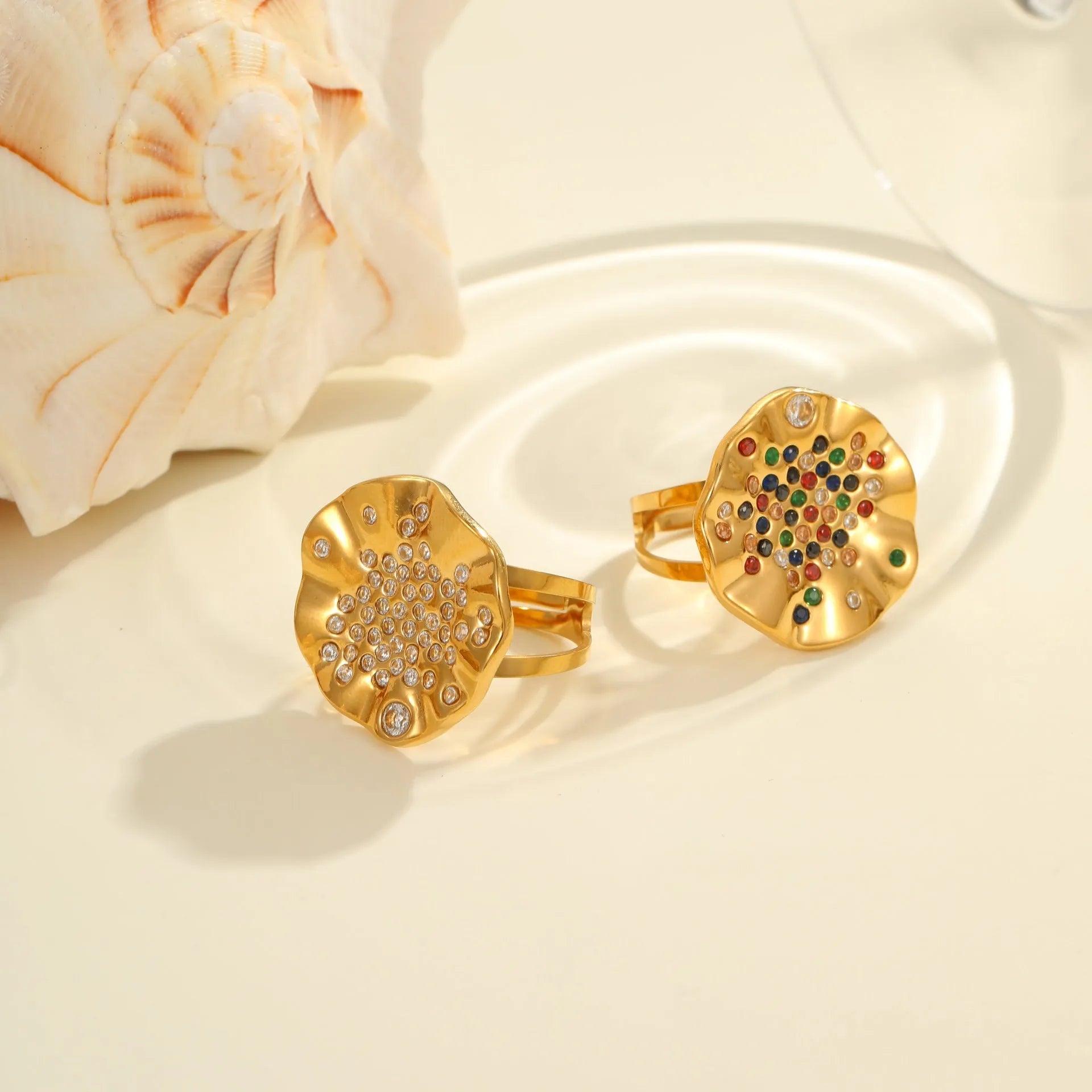 Geometric open mouth ring with pleated inlaid diamond detailing in electroplated stainless steel