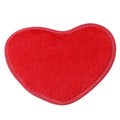 Heart-shaped polyester fibre floor mat in solid colour, size 60x70cm, on bedroom floor