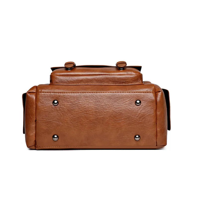 Vintage-style messenger bag in horizontal square shape with contrast stitching, shown in available colour options