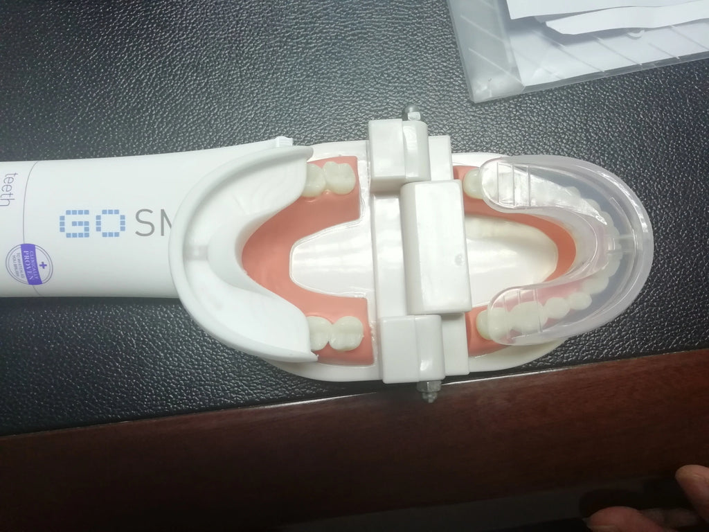 360 degree U-shaped electric toothbrush with blue light, food grade silicone bristles, and USB charging cable