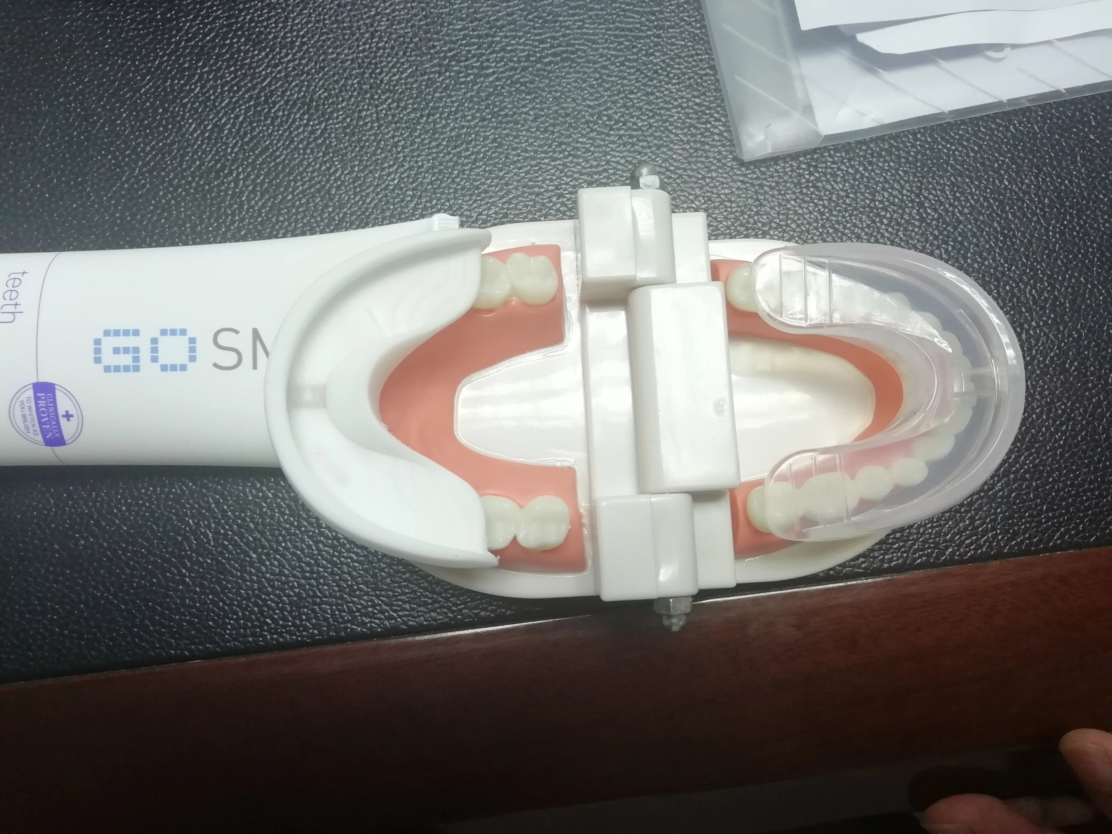 360 degree U-shaped electric toothbrush with blue light, food grade silicone bristles, and USB charging cable