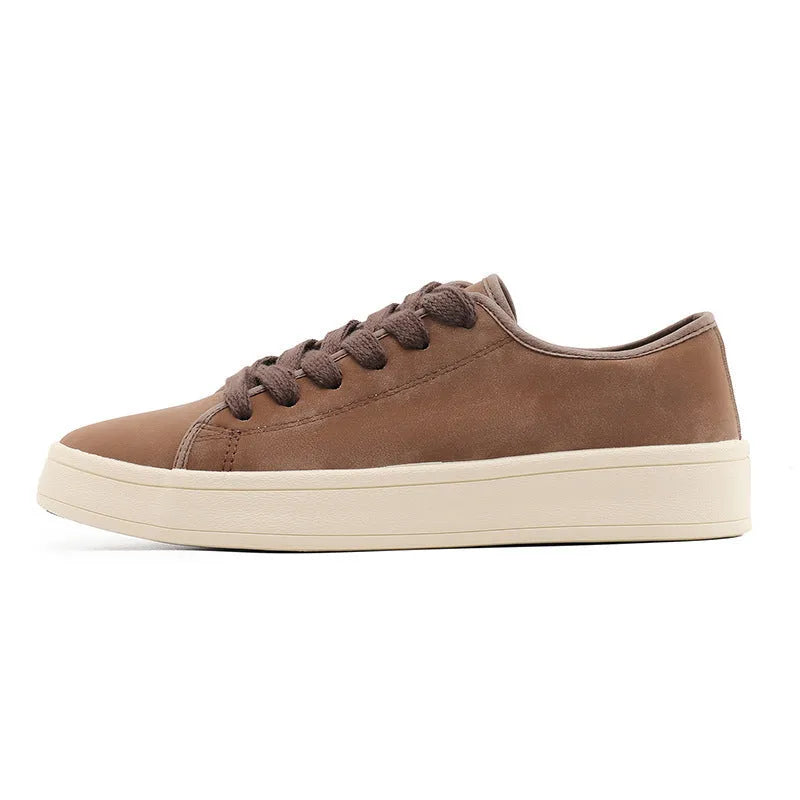 Breathable matte leather sports casual shoes in black with stitched detailing, low-top profile, and rubber sole