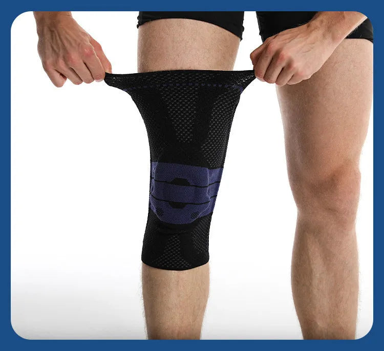 Adult sports kneecap or knee pad in black and blue colour, made from nylon spandex, shown on a knee.